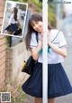 A woman in a school uniform leaning against a pole.