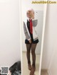 A woman taking a selfie in a mirror.